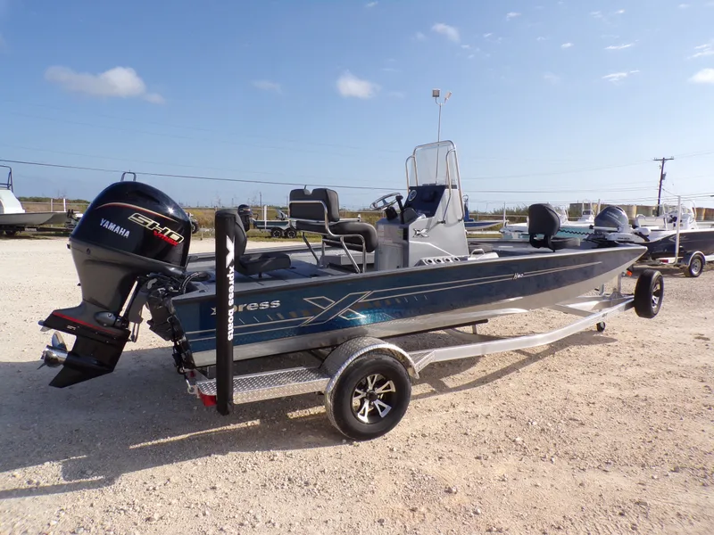 Slide: The Image of 2026 Xpress H20B Bay boat with Yamaha engine on trailer. - 8
