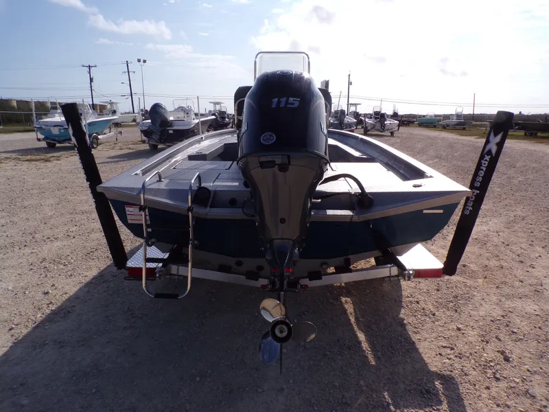 Slide: The Image of Rear view of 2026 Xpress H20B Bay boat with outboard motor. - 9