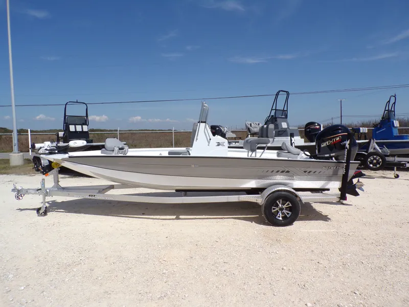 The Image of 2025 Xpress H20B Bay boat on trailer, side view. - 1