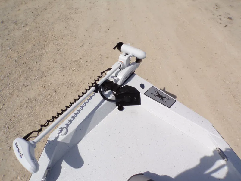 Slide: The Image of 2025 Xpress H20B Bay boat with Minn Kota trolling motor. - 12