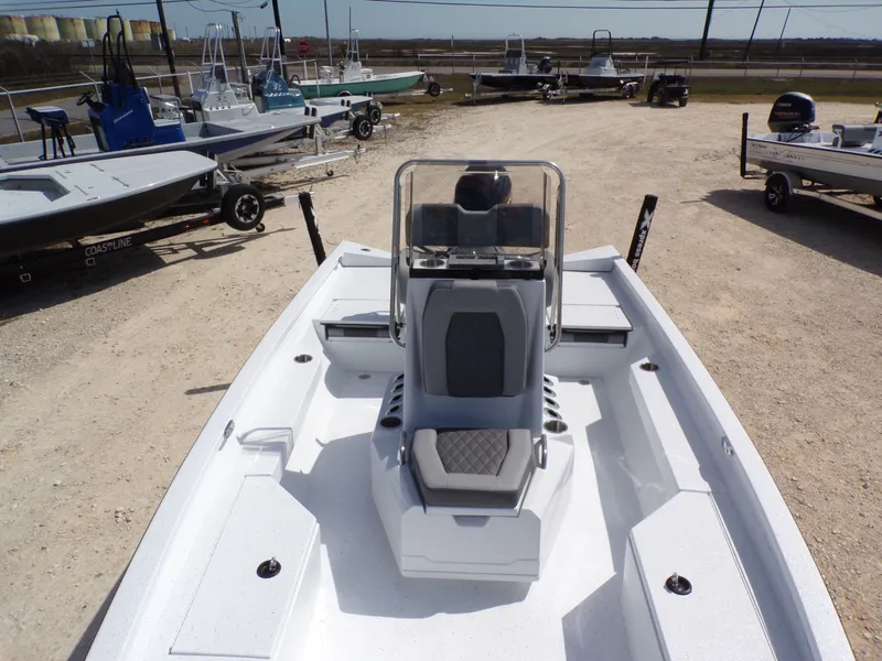 Slide: The Image of Xpress H20B Bay 2025 boat on a parking lot. - 13