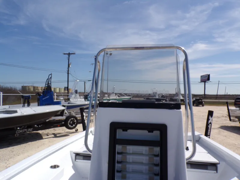 Slide: The Image of 2025 Xpress H20B Bay boat on a lot under sunny skies. - 14