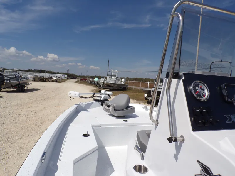 Slide: The Image of 2025 Xpress H20B Bay boat on a sunny lot. - 16