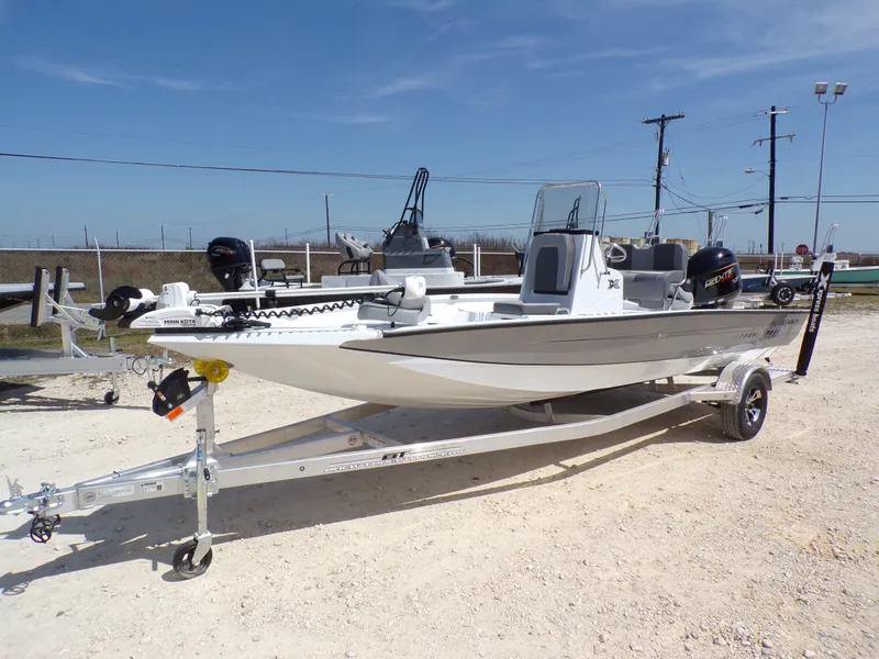 Slide: The Image of 2025 Xpress H20B Bay boat on trailer, ready for adventure. - 3