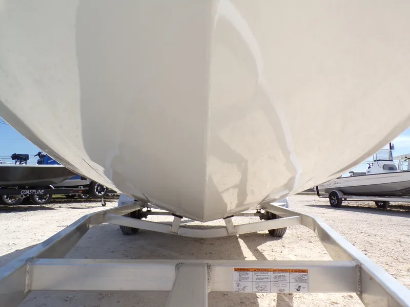 Slide: The Image of Underside of a 2025 Xpress H20B Bay boat on trailer. - 6