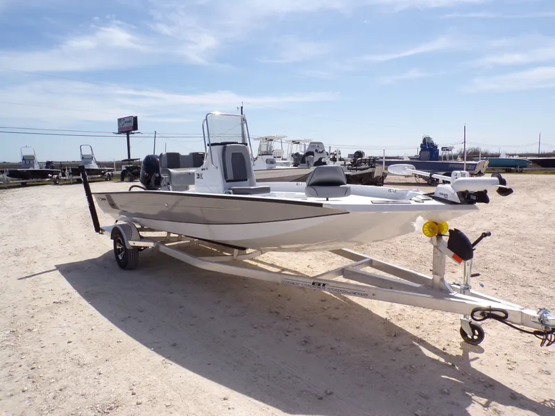 Slide: The Image of 2025 Xpress H20B Bay boat on trailer outdoors. - 7