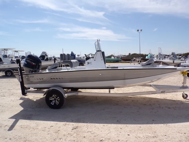 Slide: The Image of 2025 Xpress H20B Bay boat on trailer outdoors. - 8