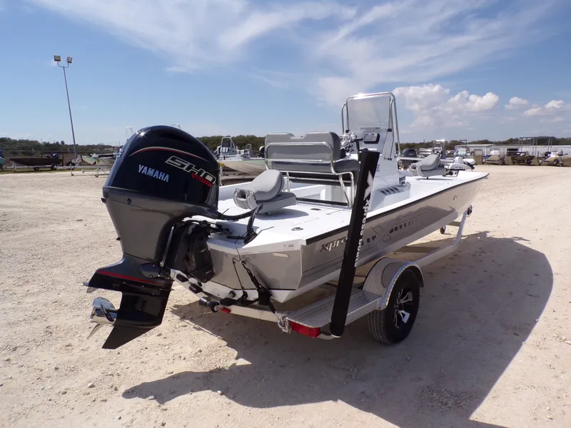 Slide: The Image of 2025 Xpress H20B Bay boat with Yamaha engine on trailer. - 9