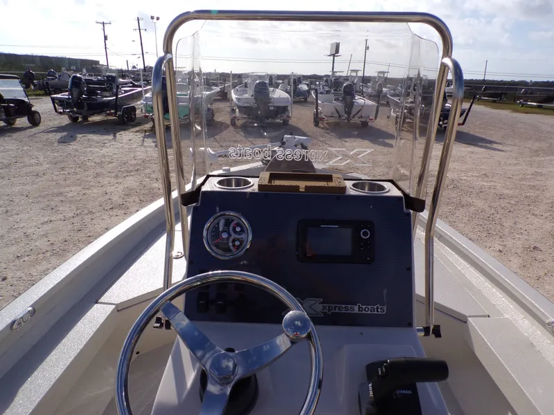 Slide: The Image of Interior view of 2026 Xpress H20BAY boat with steering console. - 24