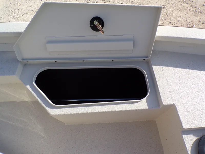 Slide: The Image of Open storage compartment on a 2026 Xpress H20BAY boat. - 5