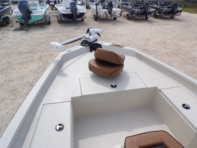 Slide: The Image of 2026 Xpress H20BAY boat with brown seat outdoors. - 15