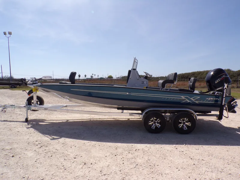 The Image of 2026 Xpress H22B Bay boat on trailer outdoors. - 1