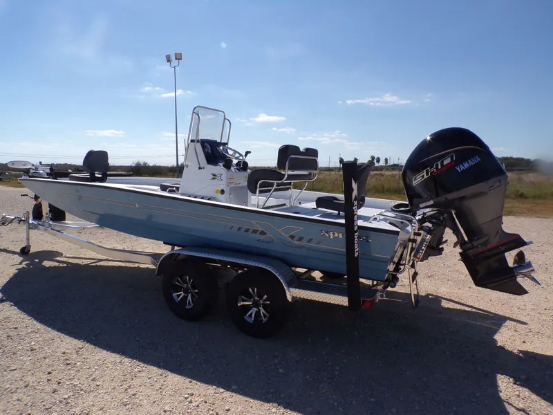 Slide: The Image of 2026 Xpress H22B Bay boat with Yamaha engine on trailer. - 10