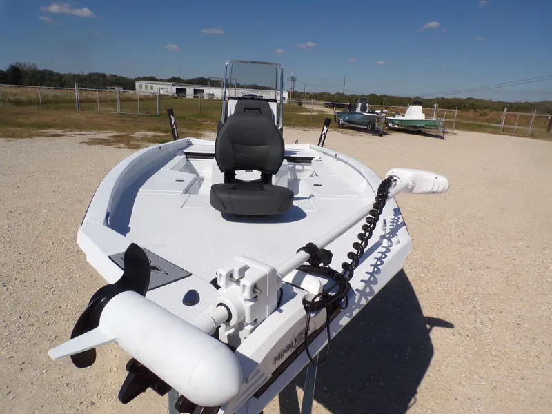 Slide: The Image of 2026 Xpress H22B Bay boat on gravel lot under sunny skies. - 12