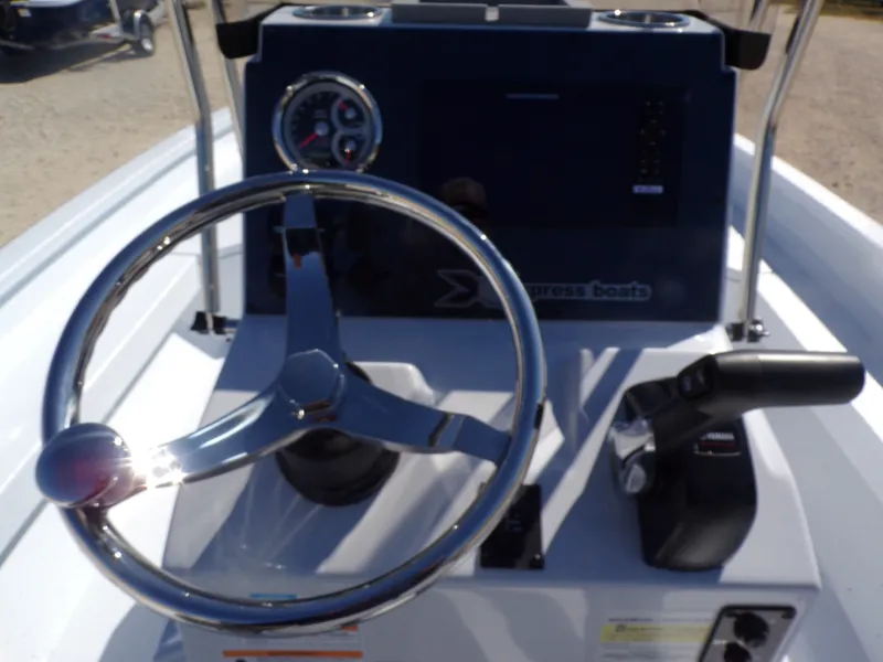 Slide: The Image of Steering console of Xpress H22B Bay boat, model year 2026. - 17