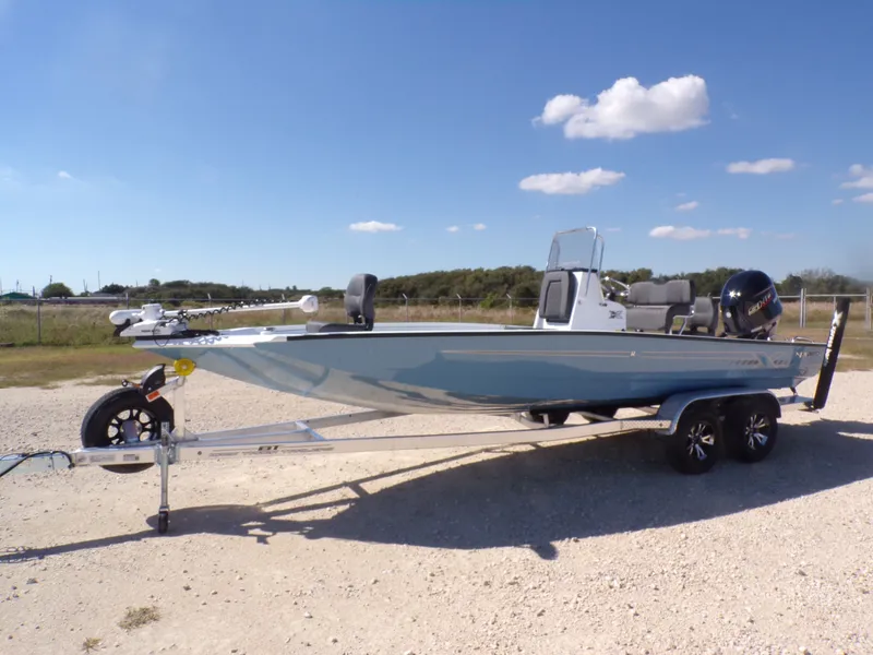 Slide: The Image of 2026 Xpress H22B Bay boat on trailer, blue sky. - 3