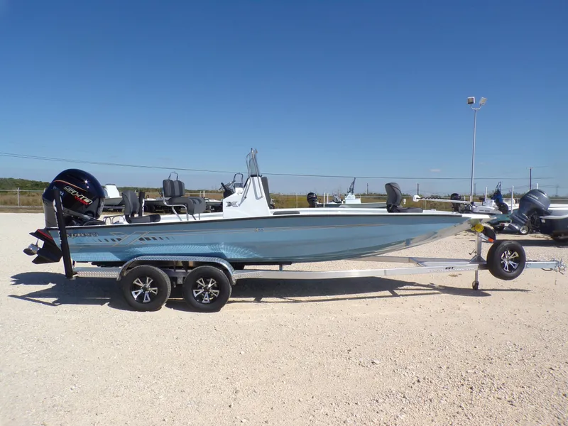 Slide: The Image of 2026 Xpress H22B Bay boat on trailer outdoors. - 7