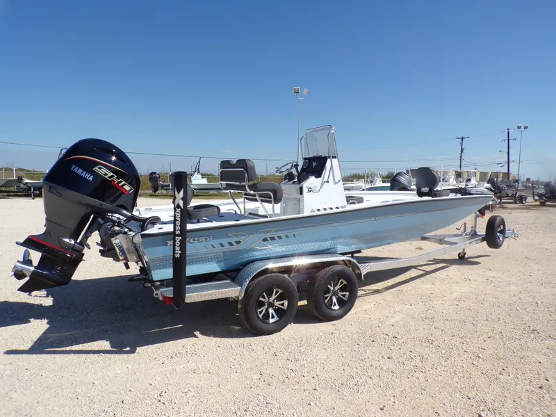 Slide: The Image of 2026 Xpress H22B Bay boat with Yamaha engine on trailer. - 8