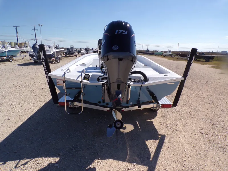 Slide: The Image of Rear view of 2026 Xpress H22B Bay boat with outboard motor. - 9