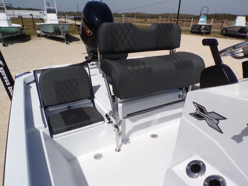 Slide: The Image of 2026 Xpress SW20B boat with modern seating and motor. - 23