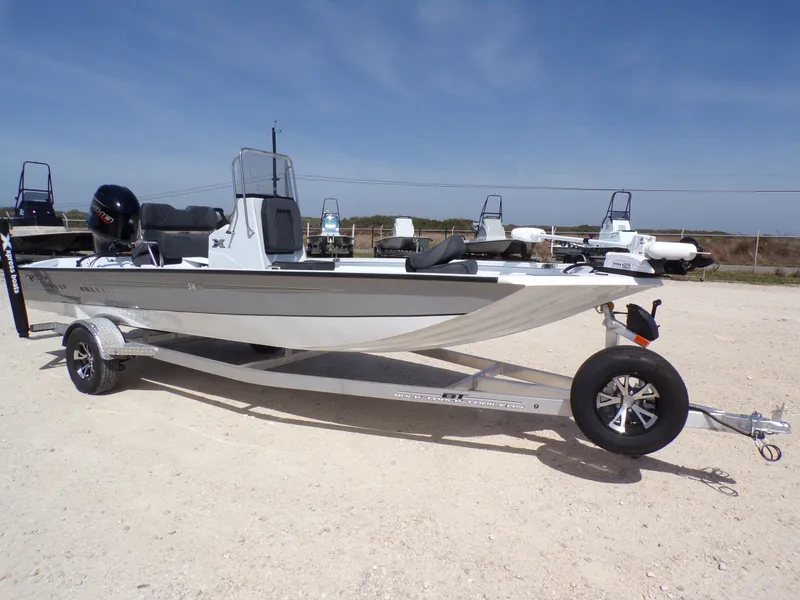 Slide: The Image of 2026 Xpress SW20B boat on trailer, side view. - 6