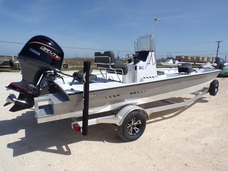 Slide: The Image of 2026 Xpress SW20B boat with Yamaha engine on trailer. - 8