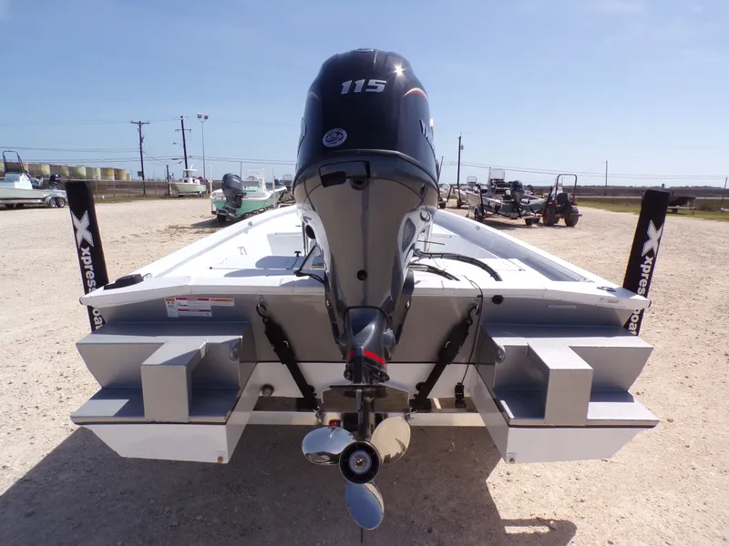 Slide: The Image of Rear view of a 2026 Xpress SW20B boat with outboard motor. - 9