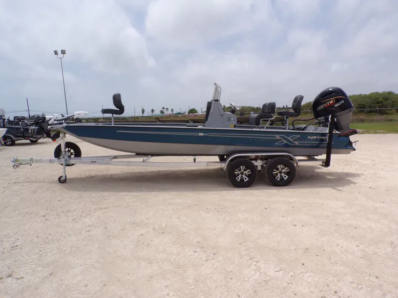 The Image of 2026 Xpress SW22B boat on trailer, side view. - 1