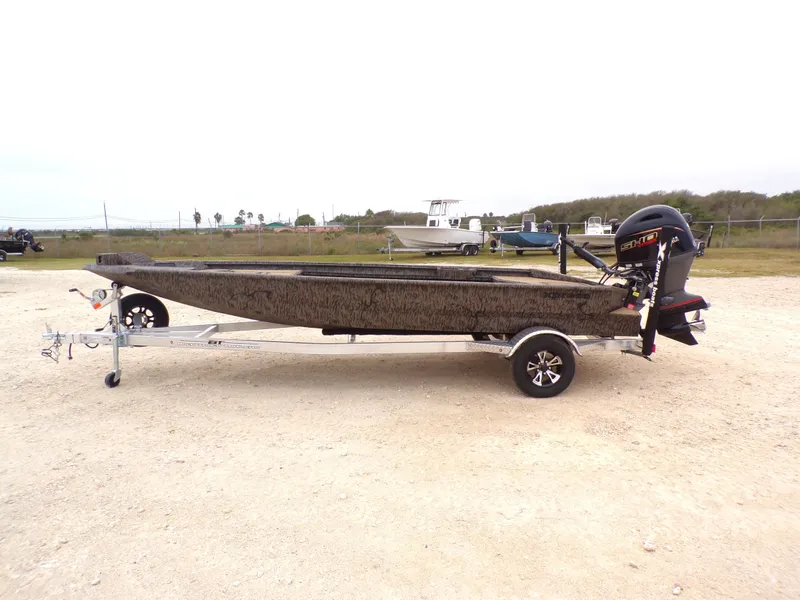 The Image of 2026 Xpress X18DB boat on trailer, side view. - 1