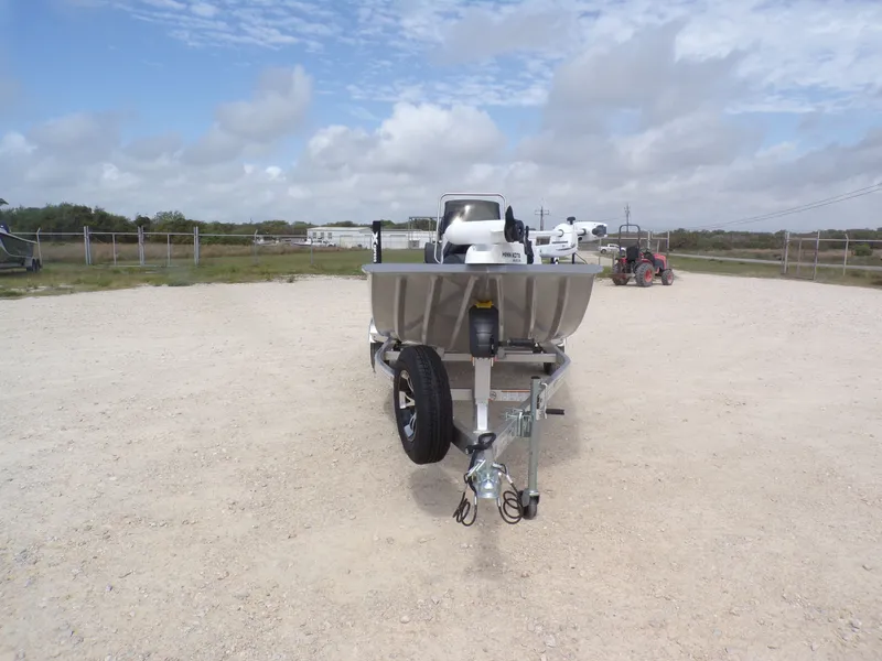 Slide: The Image of Xpress XP18CC 2026 boat on trailer, rural setting. - 6