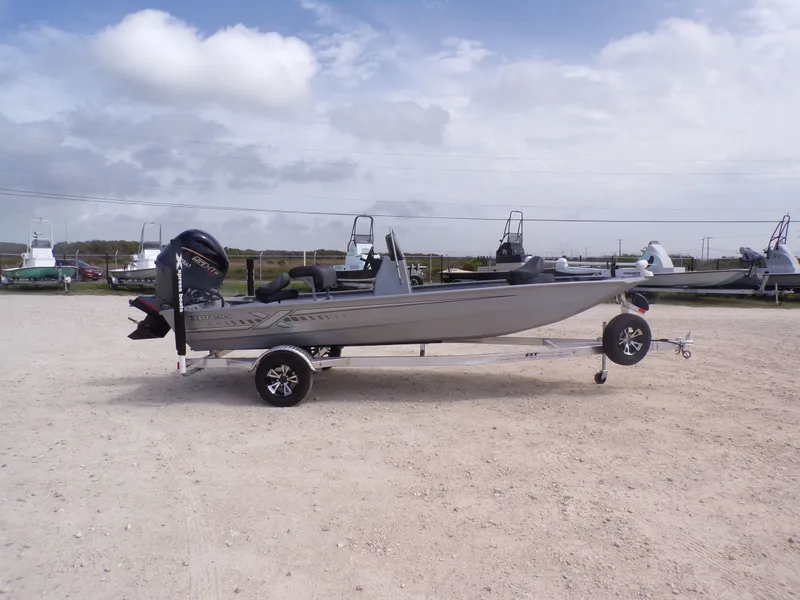 Slide: The Image of 2026 Xpress XP18CC boat on trailer, side view. - 9