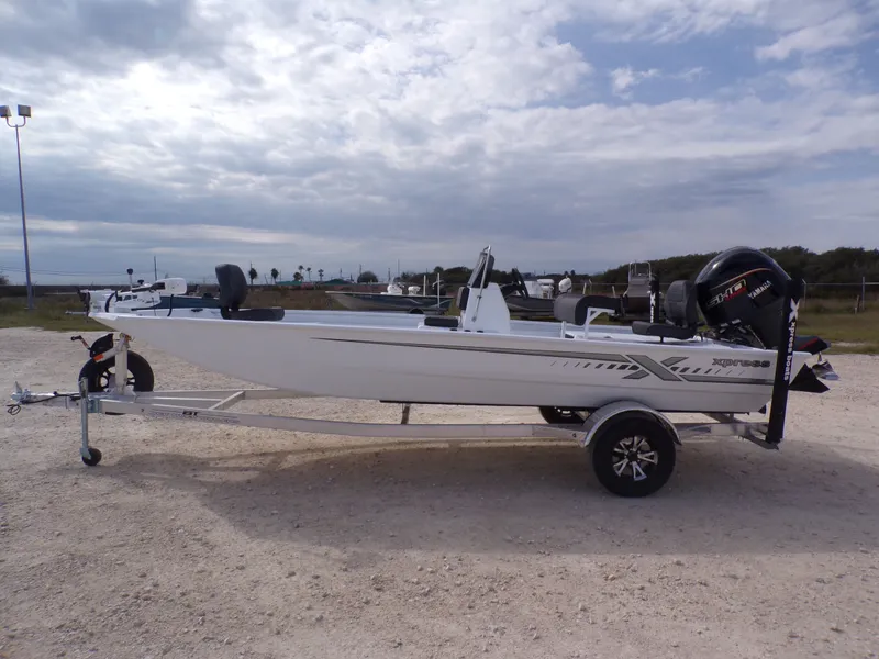 The Image of 2026 Xpress XP20CC boat on trailer under cloudy sky. - 1