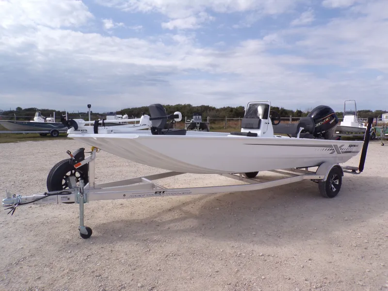 Slide: The Image of 2026 Xpress XP20CC boat on trailer, side view. - 10