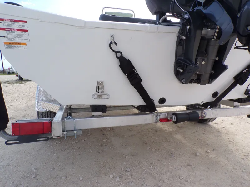 Slide: The Image of Rear view of a 2026 Xpress XP20CC boat on a trailer. - 13