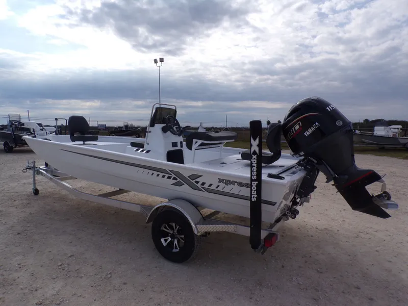 Slide: The Image of 2026 Xpress XP20CC boat with Yamaha engine on trailer. - 14