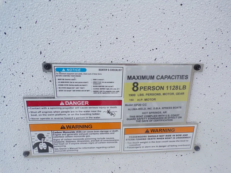 Slide: The Image of Safety warnings and capacity details for Xpress XP20CC boat. - 28