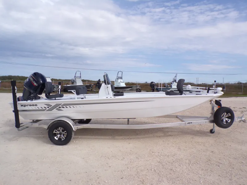 Slide: The Image of 2026 Xpress XP20CC boat on trailer, side view. - 5