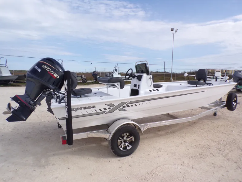 Slide: The Image of 2026 Xpress XP20CC boat on trailer, side view. - 6