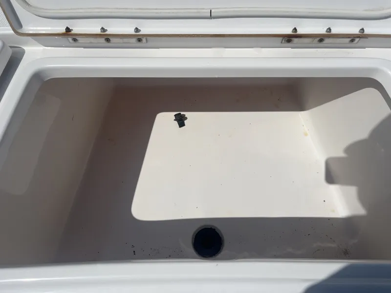Slide: The Image of Open storage compartment in Blue Wave 2300 boat, year 2017. - 13