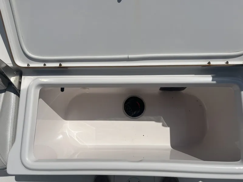 Slide: The Image of Open storage compartment in Blue Wave 2300 boat, year 2017. - 26