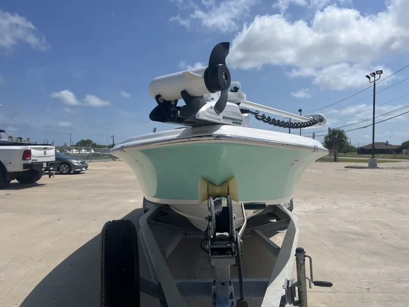 Slide: The Image of 2017 Blue Wave 2300 boat on trailer under sunny skies. - 5