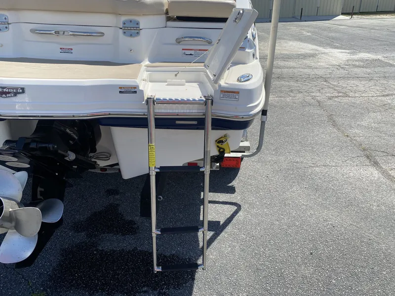 Slide: The Image of 2012 Chaparral 226 SSi boat with retractable swim ladder. - 14