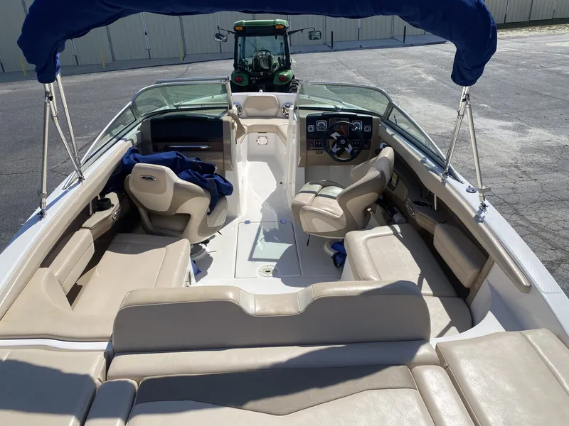 Slide: The Image of Interior of a 2012 Chaparral 226 SSi boat with beige seating. - 15