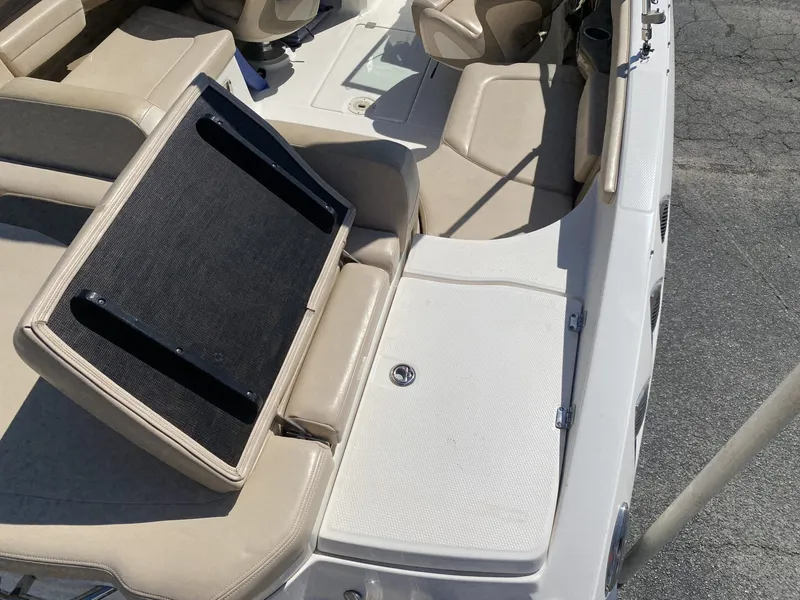 Slide: The Image of Interior of a 2012 Chaparral 226 SSi boat with beige seating. - 16