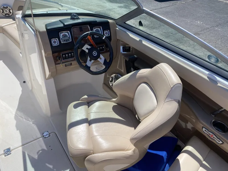 Slide: The Image of Interior of 2012 Chaparral 226 SSi with steering wheel and leather seat. - 22