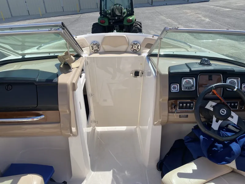 Slide: The Image of Interior view of a 2012 Chaparral 226 SSi boat with steering console. - 25