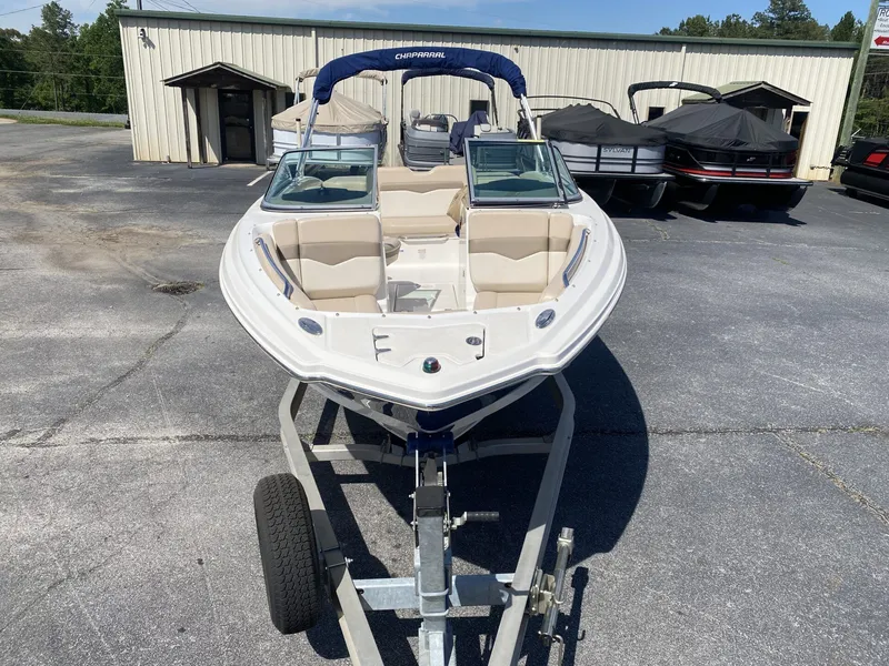 Slide: The Image of 2012 Chaparral 226 SSi boat on trailer in front of warehouse. - 6