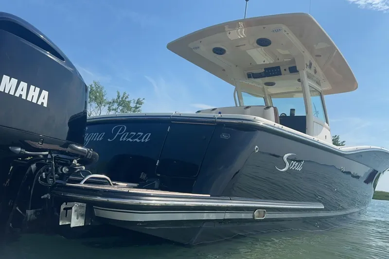The Image of 2015 Scout 320 LXF boat with Yamaha engine on water. - 0