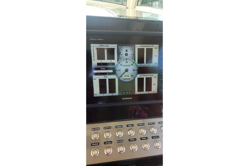 Slide: The Image of Garmin display on 2015 Scout 320 LXF boat showing RPM, temperature, and oil pressure. - 3
