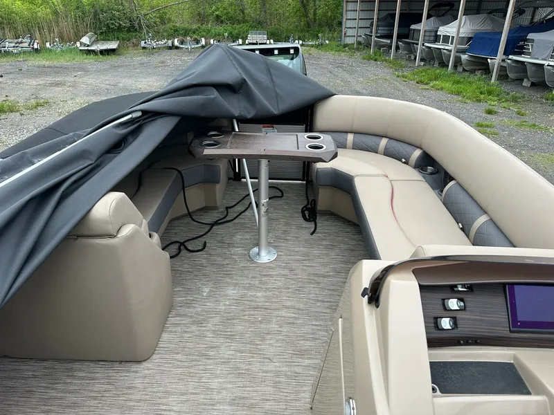 Slide: The Image of Interior of a 2022 Bennington 23 LSR pontoon boat with seating area. - 11